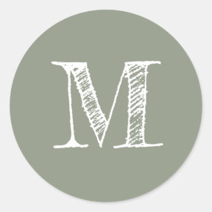 Sagegrön monograminitial runt klistermärke