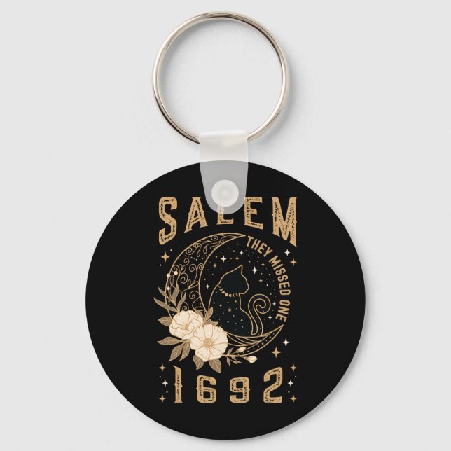 Salem 1692 De misshandlade en svart måltid M Nyckelring (Framsida)