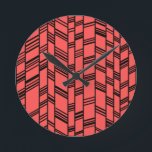 Salmon Art Deco Linjer Rund Klocka<br><div class="desc">Den här klockan har en konsdeco-design av svart lodrät linjer med svart diagonalt linjer som förbinder dem på en fält lax.</div>