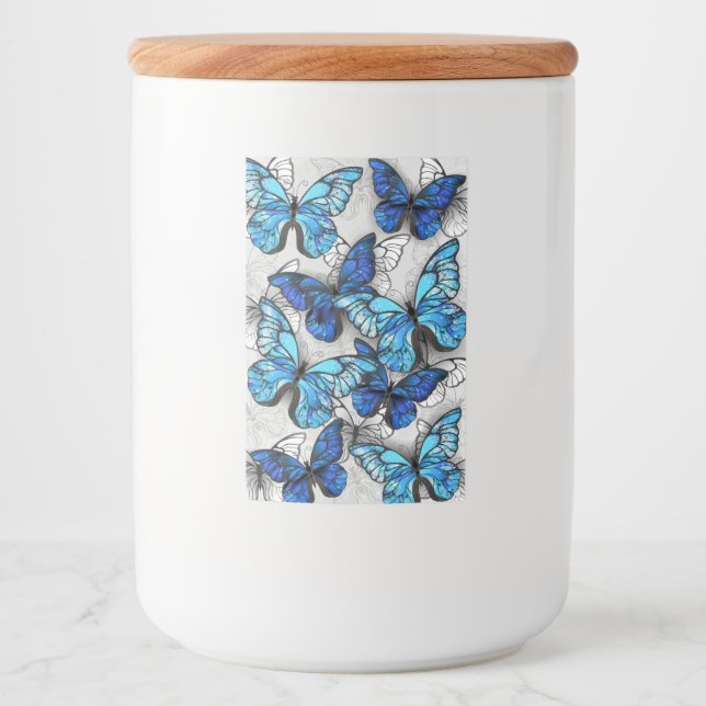 Sammansättning av vita och blå fjärilar mat etikett (Framsida)