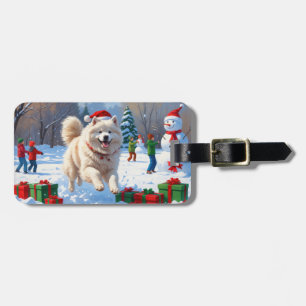 Samojed springar i snö med julhatt bagagebricka