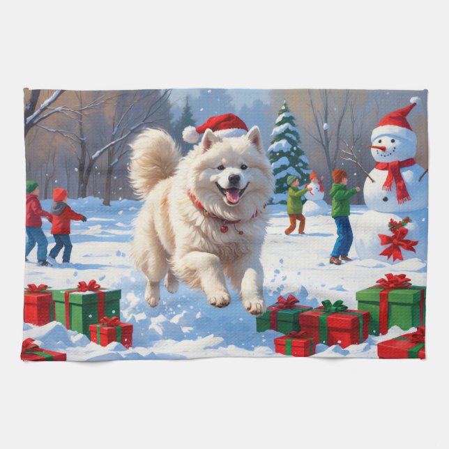 Samojed springar i snö med julhatt kökshandduk (Horisontell)