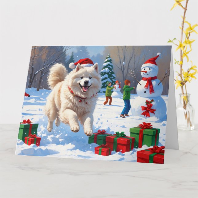 Samojed springar i snö med julhatt kort (Gul blomma)
