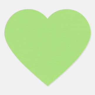 Samtidigt grönt hjärtformat klistermärke
