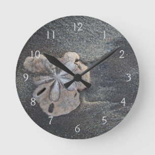 Sand-dollar på sand rund klocka
