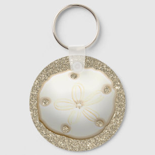 Sand-dollar på strand i glatt guld nyckelring