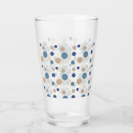 Sand och blå strandfärgade prickar glas