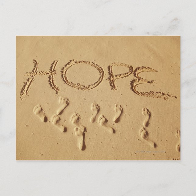 Sand skriver "Hope" på stranden med Vykort (Framsida)