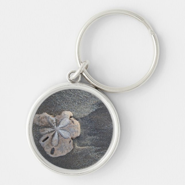 Sanddollar på sand rund silverfärgad nyckelring (Framsidan)