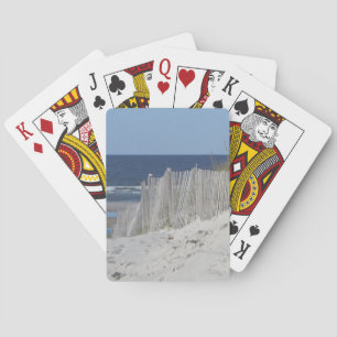 Sandig strand och ridit ut strandstaket kortlek