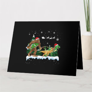 Santa Bigfoot tar Dinosaur God jul för Kort
