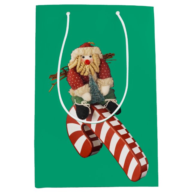 Santa Claus plays on candy can slide for fun. (Framsidan)