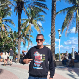 Santa Claus relaxes before the Christmas on a Grey T Shirt