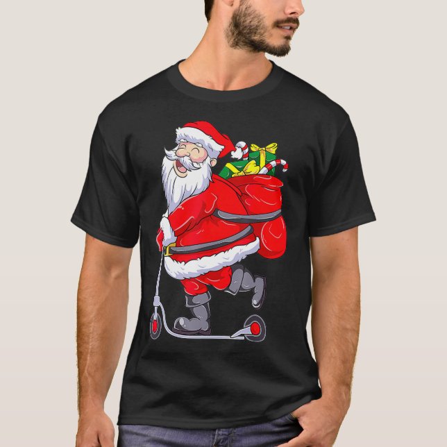 Santa Claus Riding a Push Scooter Funny Christmas  T Shirt (Framsida)