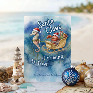 Santa Claws kommer till stan Julfirande vid kusten Julkort