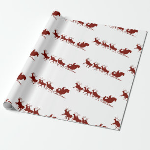 Santa och ren som slår in papper presentpapper
