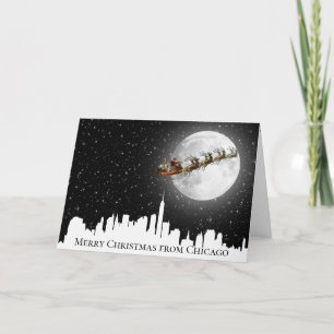 Santa och Sleigh som flyger över Big City Skyline Kort