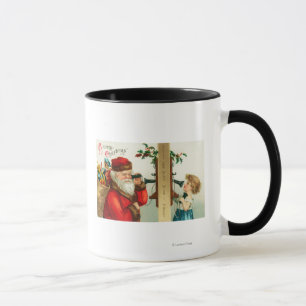 Santa på telefonen med liten flicka mugg