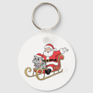 Santa Riding Sleigh med Moo Deng Baby Hippo Nyckelring