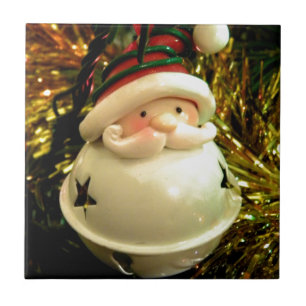 Santa sätta en klocka på kakelplatta