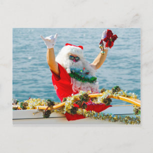 Santa som ankommer i en kanot helg vykort