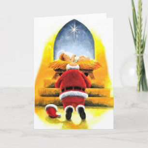 Santa som knäfaller för den babyJesus julkortet Helgkort