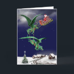 Santas drakeSleigh Helgkort<br><div class="desc">Pappa jul i sleden som dras av två flygadrakar över en snöig by. Insida kortet är några bebisdrakar med ägg och den ordgod jul och gott nytt år.</div>