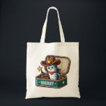 Sardine Cowboy Sheriff Tote Bag Tygkasse<br><div class="desc">Wrangle your groceries in style with this sardine cowboy sheriff tote bag! This sturdy tote features a cute sardine dressed as a cowboy sheriff with hat, star badge, and lasso — all standing inside an open vintage sardine tin. Perfect for grocery runs, beach days, library trips, or everyday errands, this...</div>
