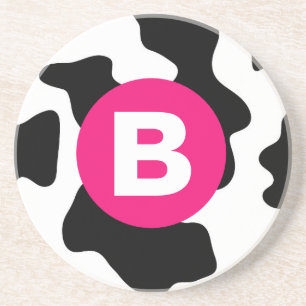 Särpräglad kofläcksmodell med rosa monogram underlägg