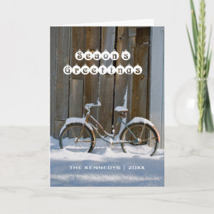 Säsongshälsningar - gammal cykel täckt i Snö Helgkort