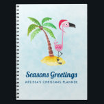 Säsonhälsningar Rosa Flamingo i Santa Hat Anteckningsbok<br><div class="desc">En anteckningsbok med texten: Säsonhälsningar. En viskig teckning av en rosa flamingo som bar en röd tomhatt. Stå på ett berg av strand med gult med grönt och brunt kokosnöt handflatan träd i ryggen. Ljusblå bakgrund med svag polygonal mönster. Tur- och roligt-tropiska former.</div>