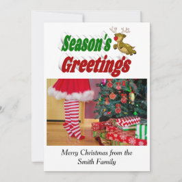 Säsonhälsningar som flyger renjulfoto julkort