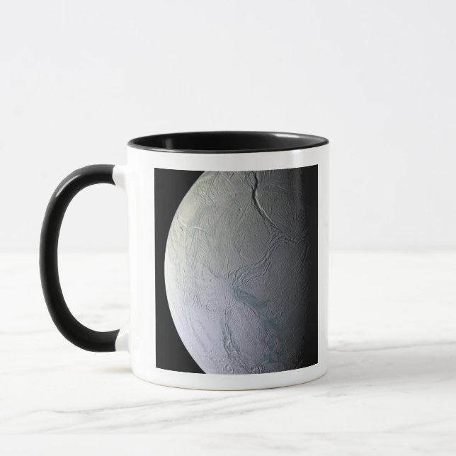 Saturns måne Enceladus Mugg (Vänster)
