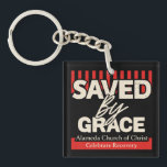 Saved by Grace Alamina Church of Christ key chain<br><div class="desc">"Saved by Grace" Keychain – Alameda Church of Christ Celebrate faith and strength with this inspiring "Saved by Grace" t-shirt, featuring 2 Corinthians 12:9: “My grace is sufficient for you, for my power is made perfect in weakness.” Perfect for members of Alameda Church of Christ or anyone wanting to share...</div>