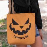 Scary Jack o lantern Anpassningsbar Orange Hallowe Tygkasse<br><div class="desc">Den här skämtsamma orangen Halloween har en coola som leker Jack o lantern och din egen personlig. Cute och skrämmande väskor i anpassningsbar party till använda för bus eller godis eller party favors.</div>