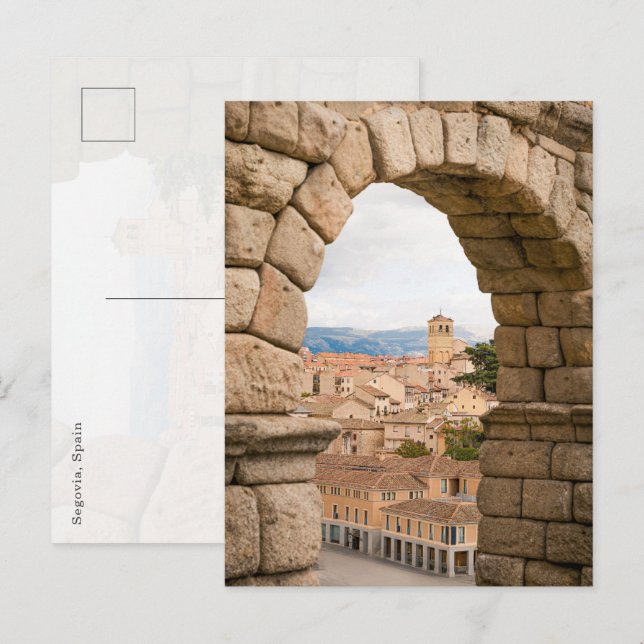 Scenic view of Segovia through the Roman aqueduct Vykort (Fram/baksida)