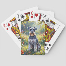Schnauzer i äng med vilda blommor