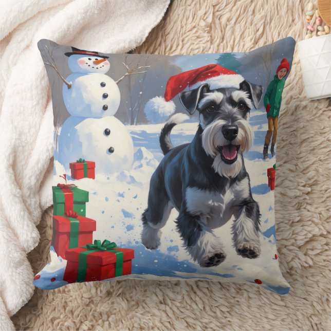 Schnauzer springar i snö med julhatt kudde (Filt)