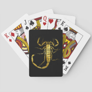 Scorpion i guld som leker kort spelkort