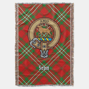 Scott-klanens vapen över röd tartan filt