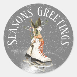SEASONER HÄLSNING WINTER SCENE MED ICE SKATES RUNT KLISTERMÄRKE