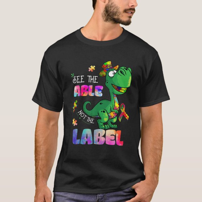 See The Able Not The Label Dinosaur Autism Awarene T Shirt (Framsida)