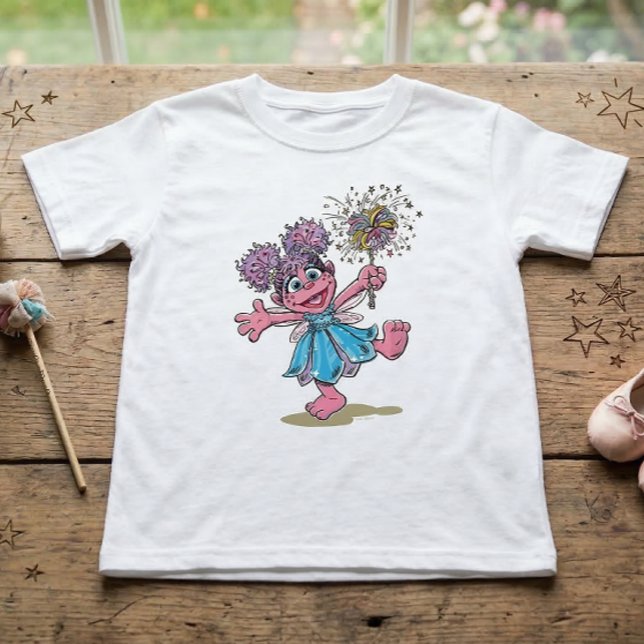 Sesame Street Abby Cadabby Retro Art T Shirt (Generated image of t-shirt on table)