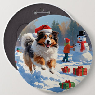Shetland Sheepdog springer i snö med julhatt Knapp
