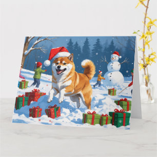 Shiba Inu springar i snö med julhatt Kort