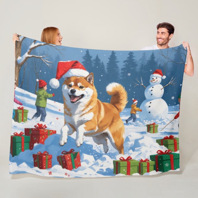 Shiba Inu springer i snö med julhatt Fleecefilt (På plats)