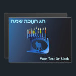 Shiny Blue Chanukkah Menorah<br><div class="desc">En moderniserande,  metallisk,  blå Chanukkah-menorah,  med en lejon i silhouette,  mot en mörk,  natteliknande bakgrund. Alla nio ljusen är tända. Den hebreiska text som lyder "Chag Chanukkah Sameach" (Lycklig Hanukkah) förekommer också i blått och vitt ljus. Lägg till ytterligare text.</div>