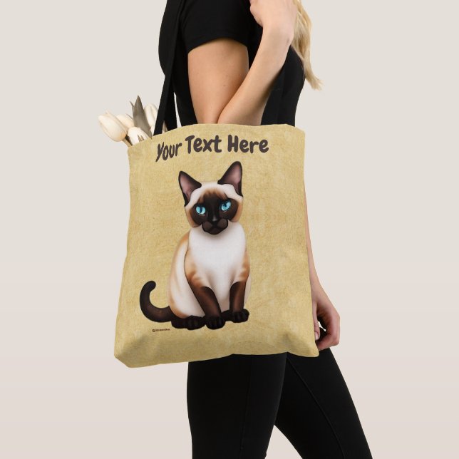 Siamesisk katt på gammal Papper Tygkasse (Närbild)