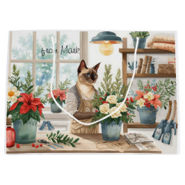 Siamesisk katt som arrangerar blommor Vinter jul