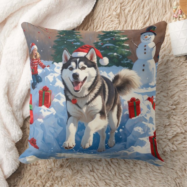 Siberisk Husky som springer i snö med julhatt Kudde (Filt)